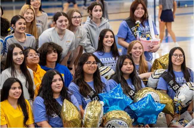 The Badminton team celebrates seniors, teachers, and big games all in one night